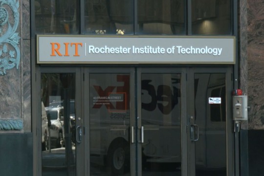 exterior of a building with an R I T sign.