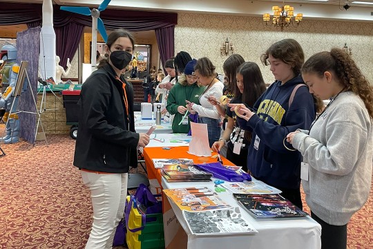 Dr. Salsbery working with students on science project