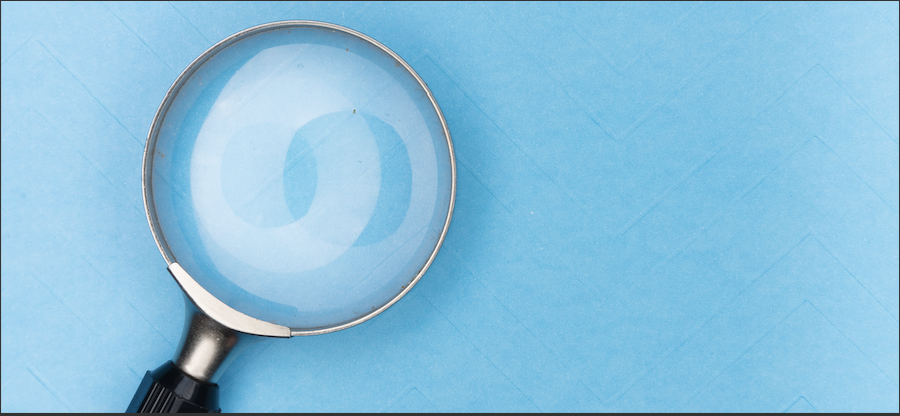 Magnifying Glass Against Blue Background