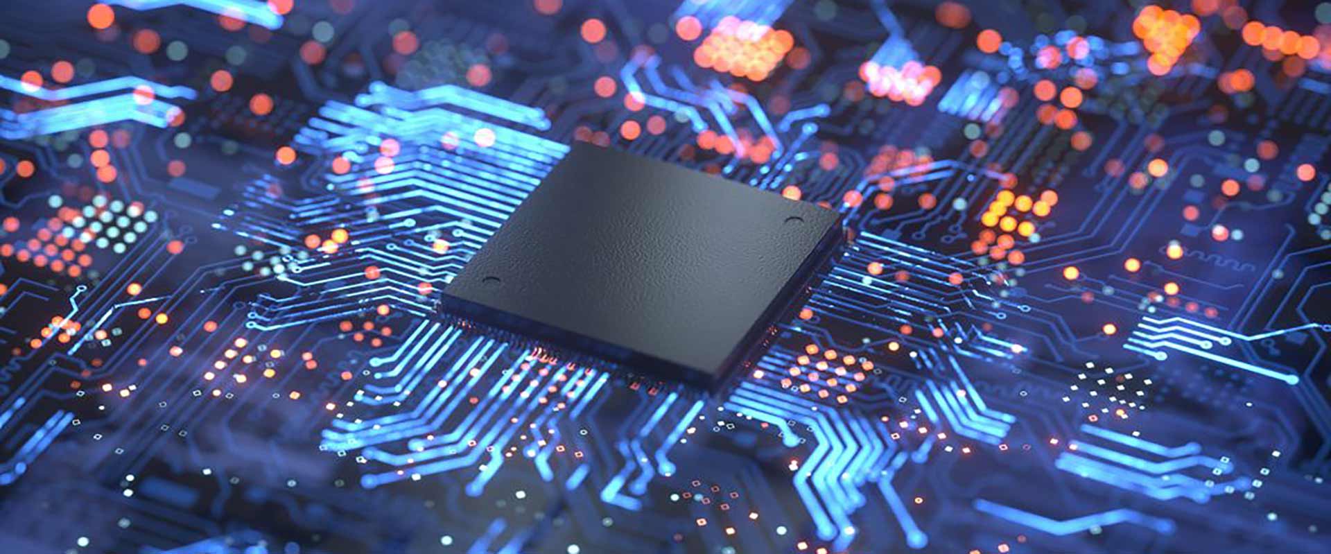 colorful blue, purple, and orange lights illuminate a circuit board and chips