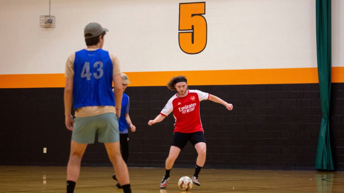 Students playing Intramural soccer in the fieldhouse at RIT 