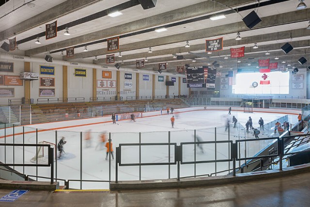Students playing hockey.