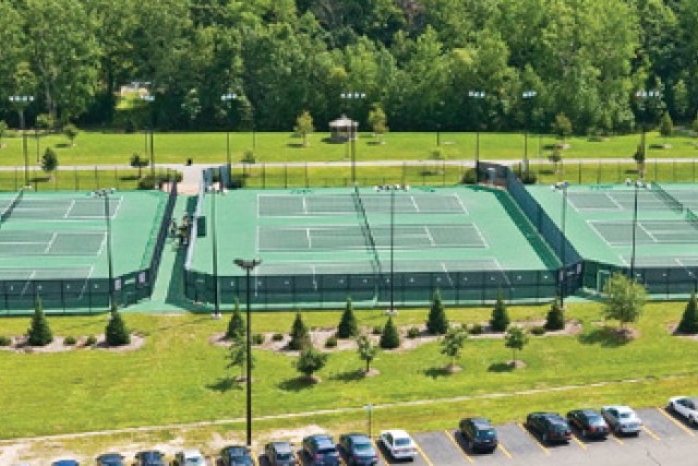 Aerial view of 9 tennis courts.
