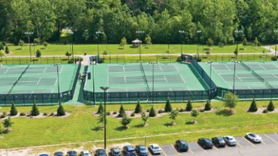 Aerial view of 9 tennis courts.