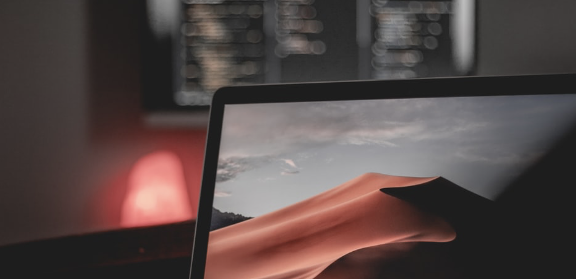 A computer in a dimly lit room