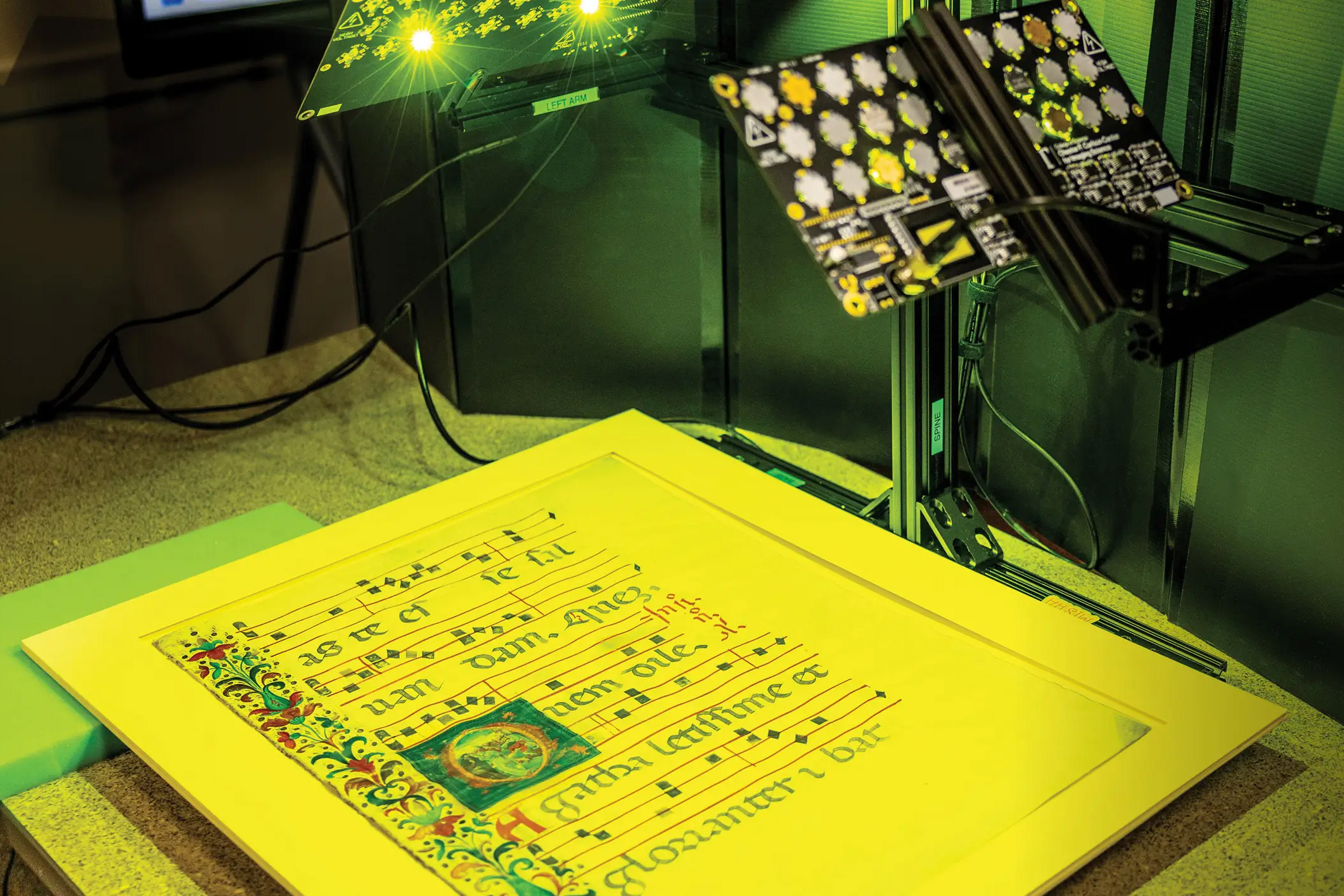 An old document sitting on a table, about to be scanned by the Multispectral Imaging System for Historic Artifacts (MISHA).