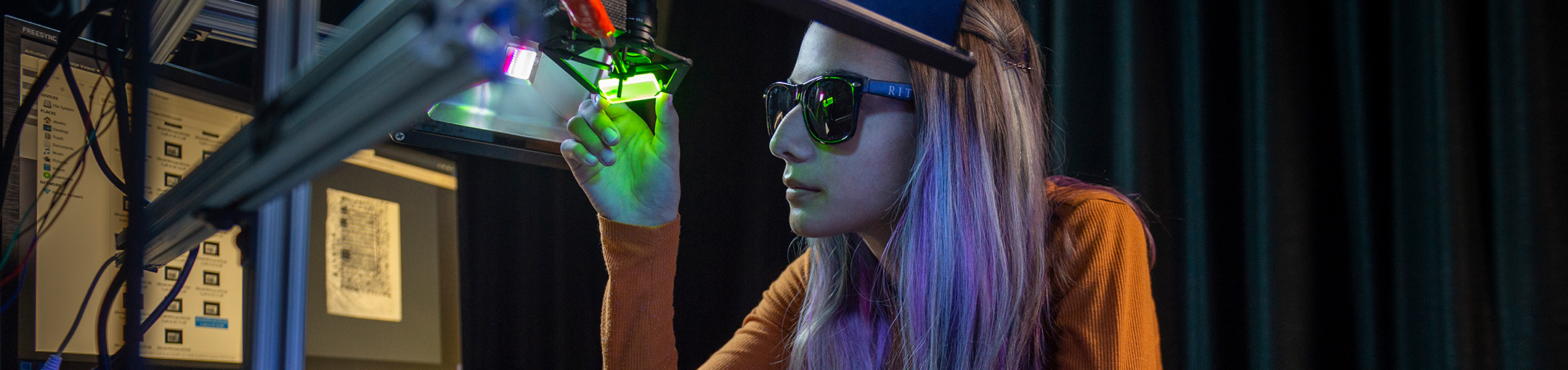 female student using ultraviolet fluorescence imaging