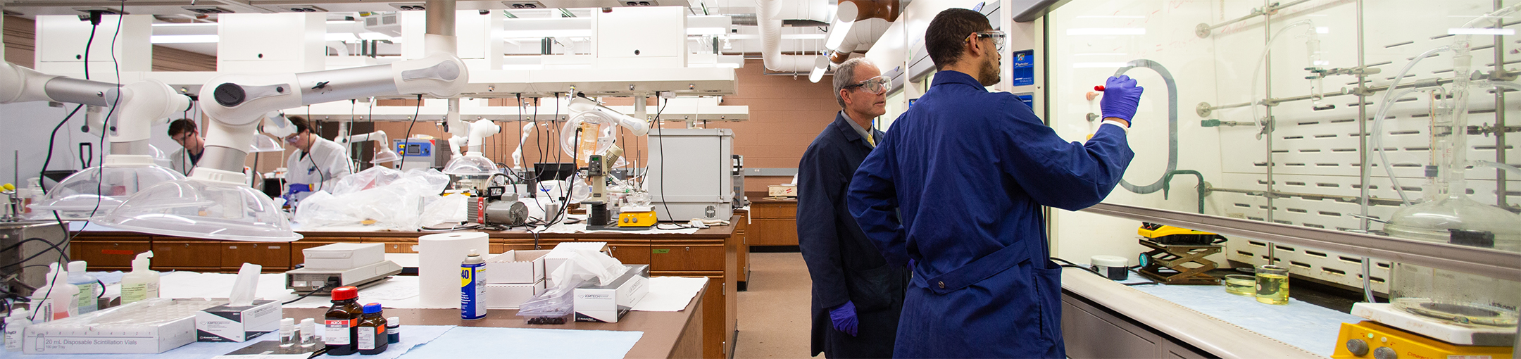 male faculty and student working in chemistry lab