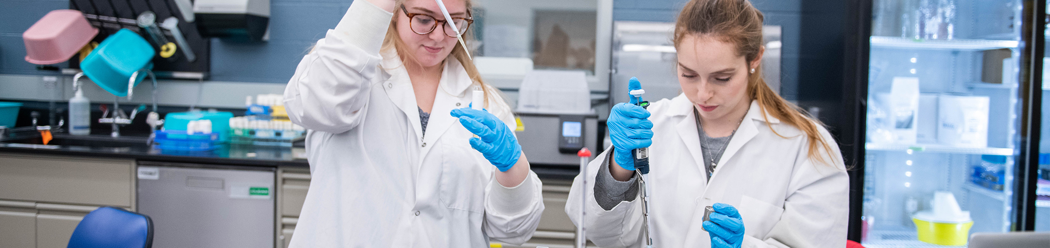 two female students working in biology class