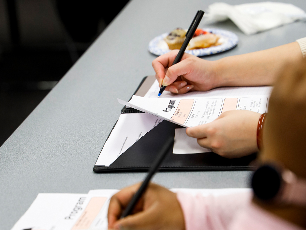 close up of students taking notes