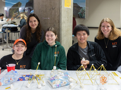 students building spaghetti marshmallow towers