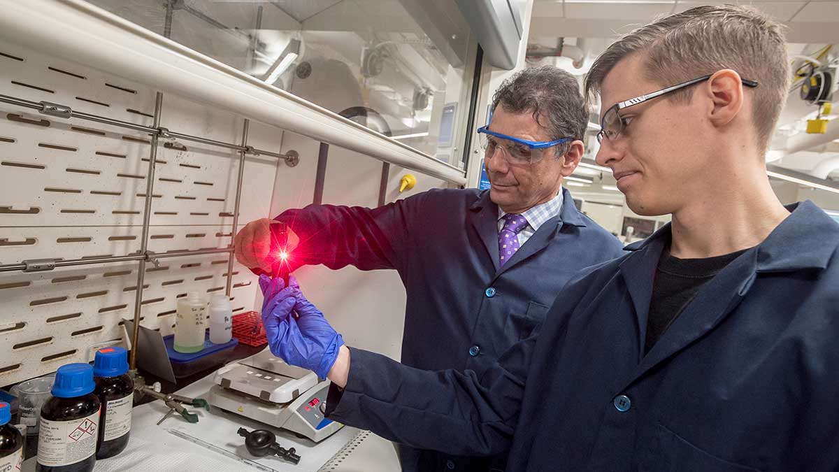 student and professor in chemistry lab