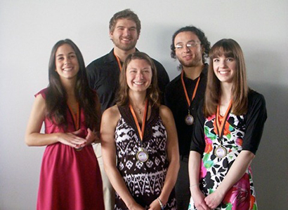 group shot of students wearing medallions
