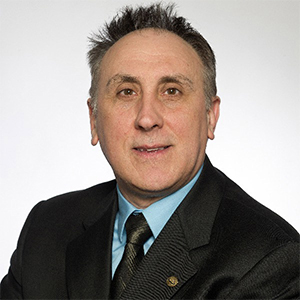 headshot of Carlos Lousto