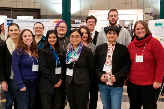 a group of eleven researchers poses for a photo.