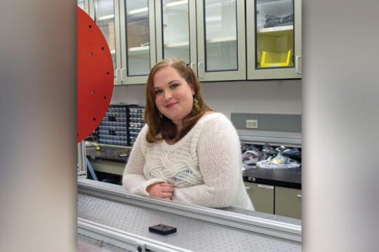 student poses in lab.