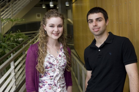 Two people posing for camera