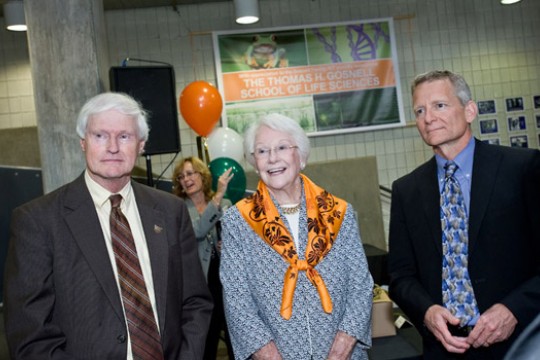 Three people posing for camera