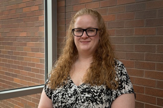 Head-and-shoulders view of woman with glasses.