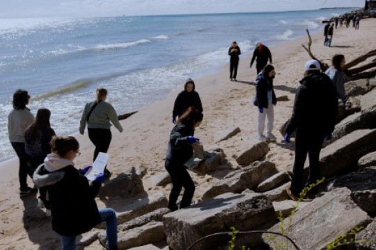 Loyola University students collect trash at Hartigan Beach 