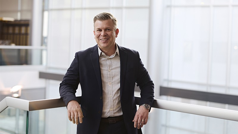 Tim Gross standing in the hallway at Corning