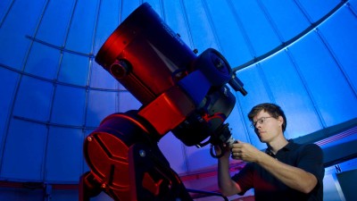 Person calibrating a telescope
