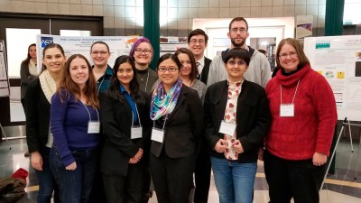 a group of eleven researchers poses for a photo.