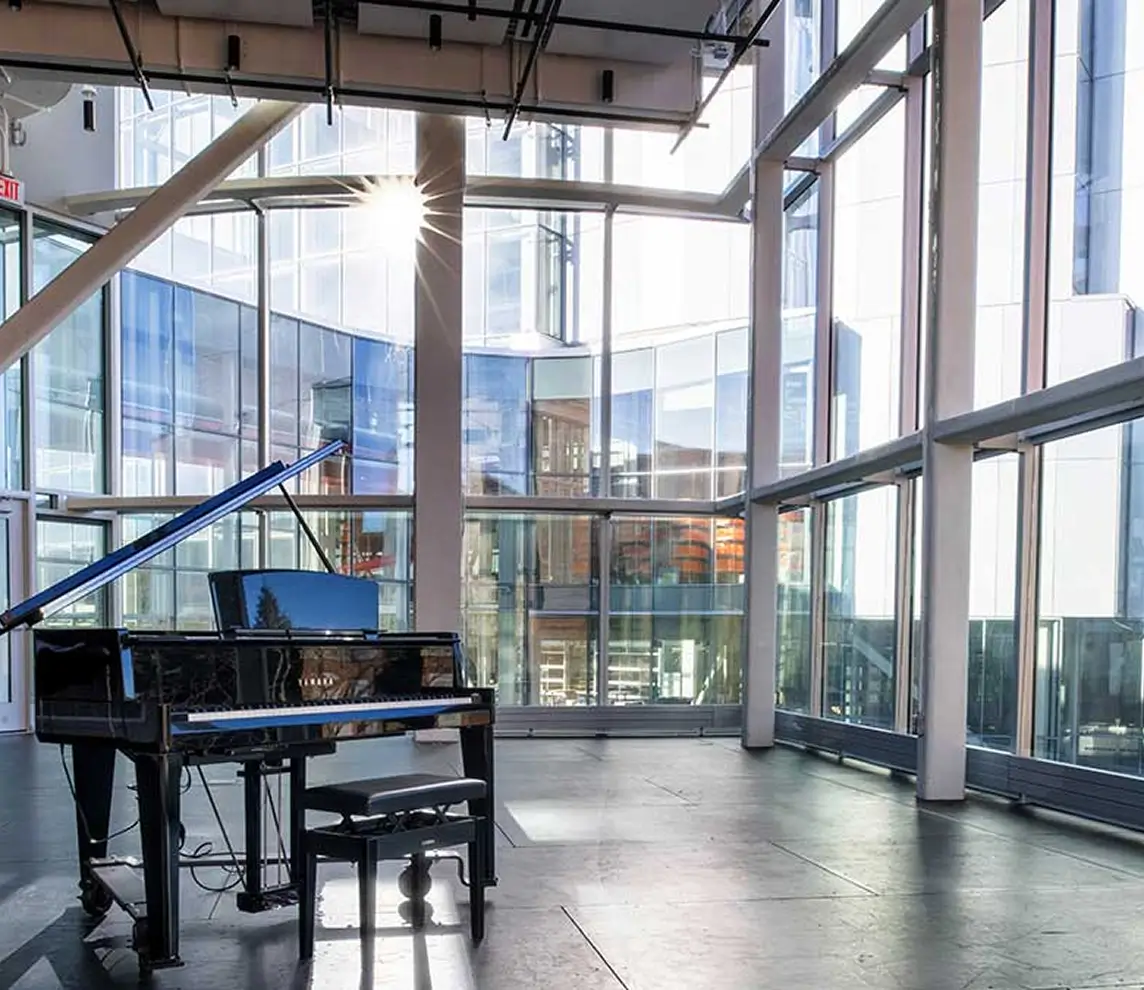 A piano sitting in the Munson Music Loft, in the SHED.