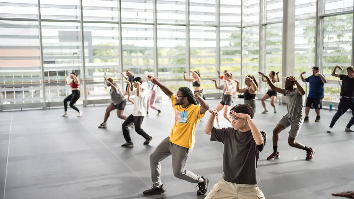 A group of R I T students dancing in the SHED.
