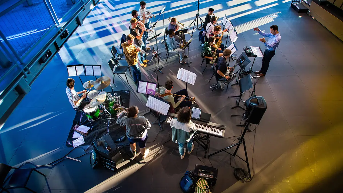 One of R I T's student bands performing in the Sklarsky Glass Box Theater.