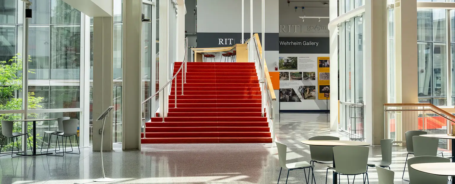 Interior of SHED, featuring an orange staircase.
