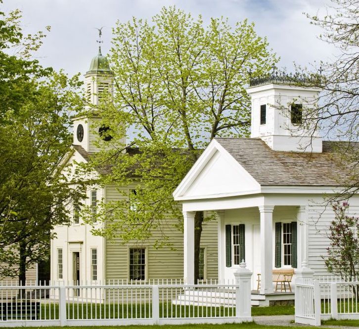 Two white historic buildings at Genesee Country Village & Museum