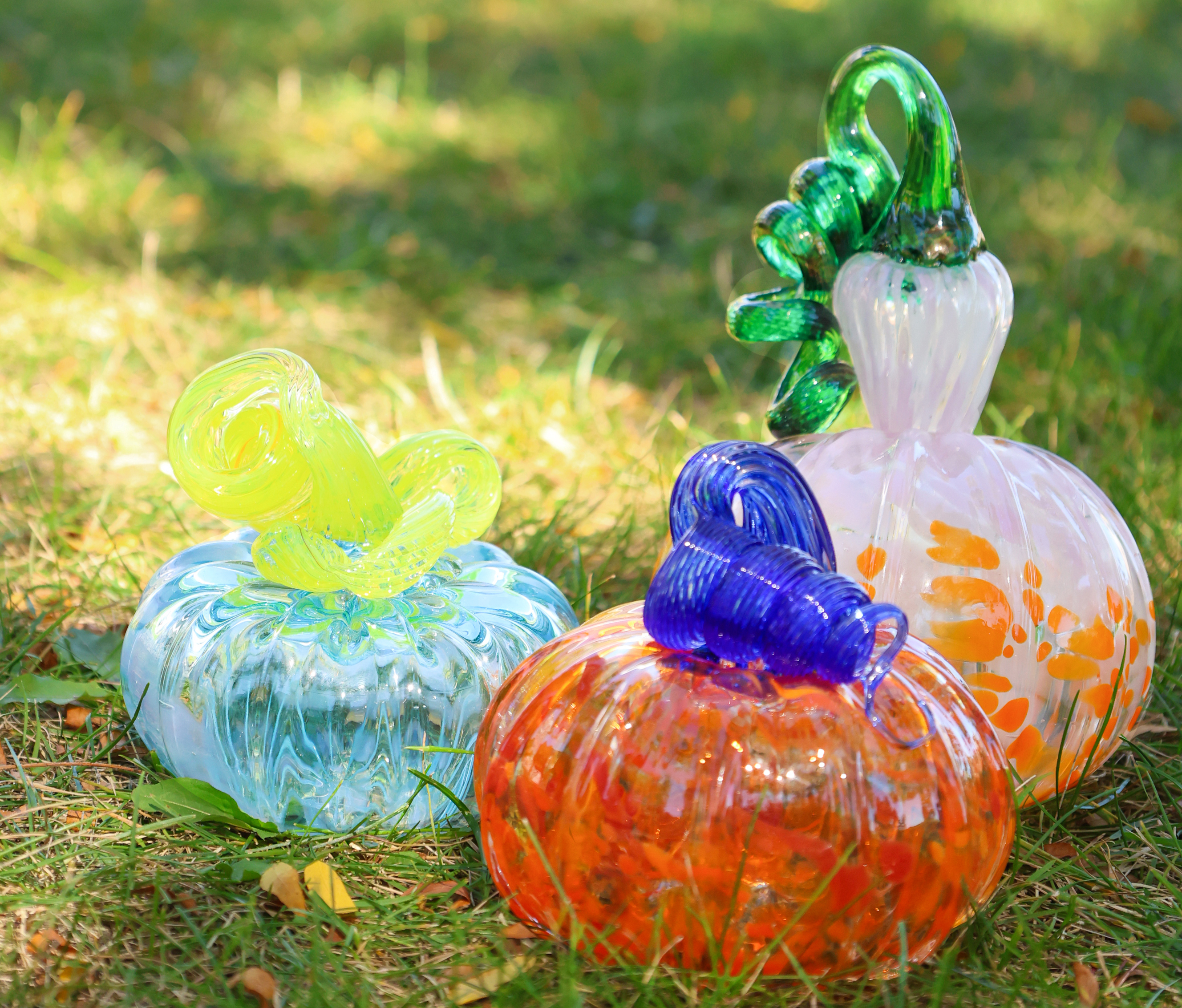 three glass pumpkins