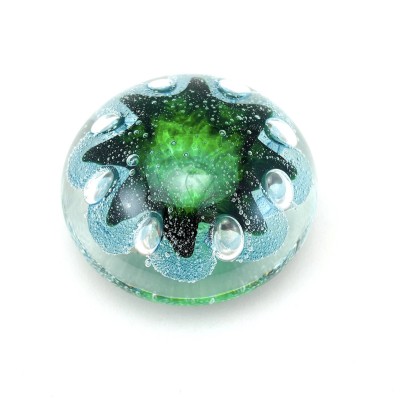 Handblown clear Glass orb with bubbly green and blue organic shape inside.