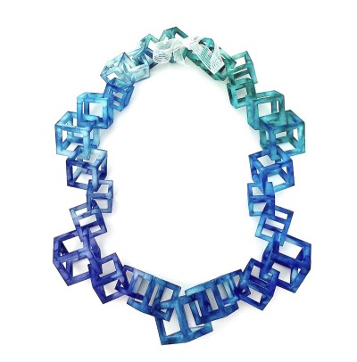 3D Printed nylon cubes of various sizes hand dyed blue with ribbon tie.