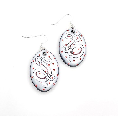 hand illustrated Ceramic dangle Earrings with small red hearts and a black line drawing of a snake with red details.