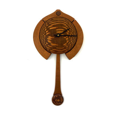 Wooden stippled round clock face with different toned decorative framing and long swooping pendulum.