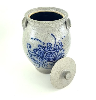 Lidded ceramic vessel with compact side grasp handles. Glaze is light grey with hand illustrated floral decoration in cobalt blue titled 'Bouquet'.