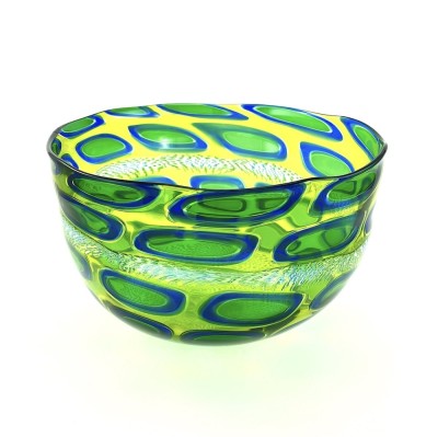 Blown glass wide bowl with a chartreuse substraight and oblong oval shapes with a bright blue outline and line green interior.