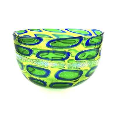 Blown glass wide bowl with a chartreuse substraight and oblong oval shapes with a bright blue outline and line green interior.