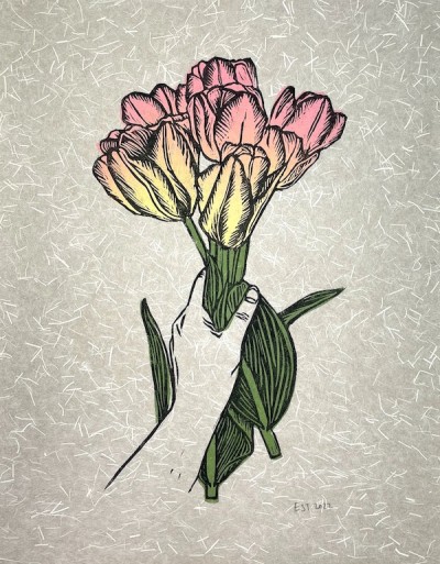 A linocut print illustration of a hand holding a bunch of cut tulips in pink and yellow on a textured paper.