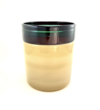 a glass cylinder with a smooth surface and ivory color base, a band of purple and green colored bands around the rim.