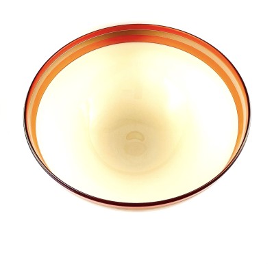 a glass bowl with a smooth surface and ivory color base, a band of rose, bronze and melon colored band around the rim.