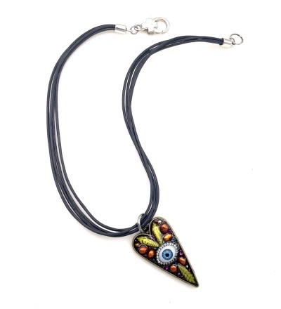 a necklace with four black strands with a heart shaped pendant with a cluster of beads and glass blue eye encased in acrylic.