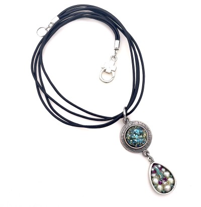 two pendants made from glass shards set in resin with a tear drop set with pearls and beads strung on four black cords with a metal clasp..