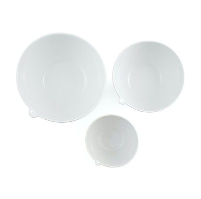 a set of three smooth white ceramic mixing bowls in graduated sizes to nest together.