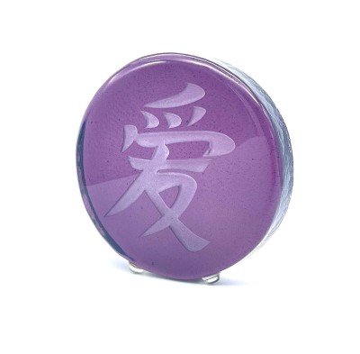a round purple glass disc with a sandblasted Chinese characture 'Love'.