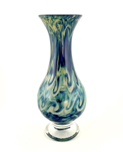 a hand blown teardrop shaped glass vase with a stormy swirl pattern of blues and greys across the surface.