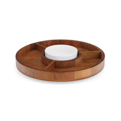 a round wood lazy susan with three compartments and a white porcelain dish in the center.
