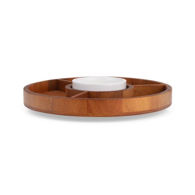a round wood lazy susan with three compartments and a white porcelain dish in the center.